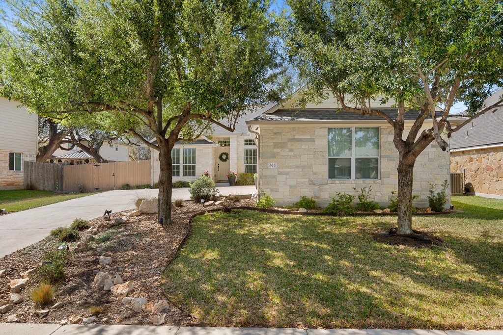 322 River Bluff Circle Georgetown, TX 78626 - Photo 31 of 35 a view of a yard with a house and a tree