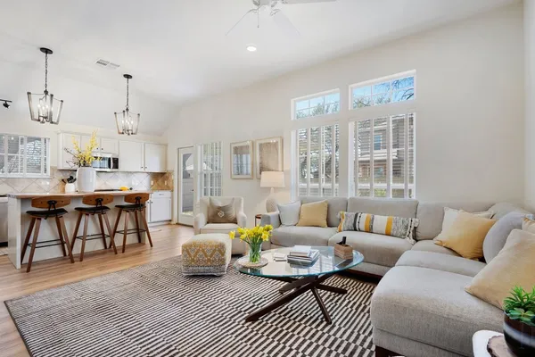 a living room with furniture and a large window