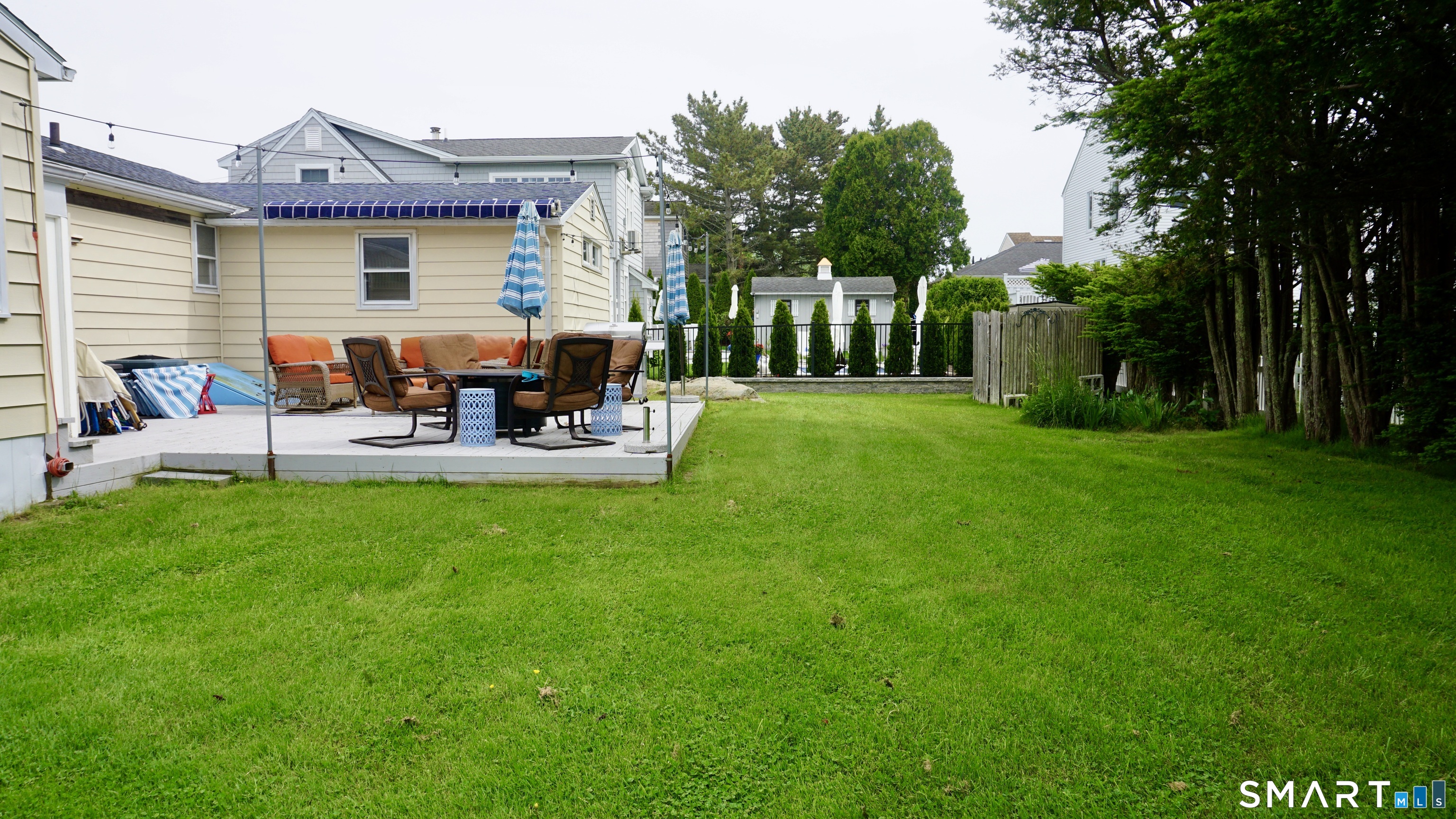 13 Pacific Street Groton, CT 06340 - Photo 20 of 31 a view of a house with backyard and sitting area