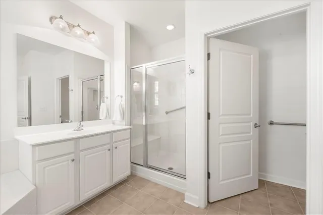 a bathroom with a double vanity sink mirror and double