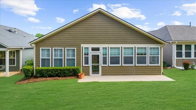a front view of a house with a yard and porch