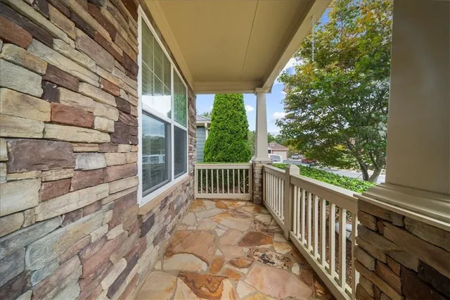a view of a balcony with wooden floor