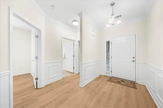 an empty room with wooden floor