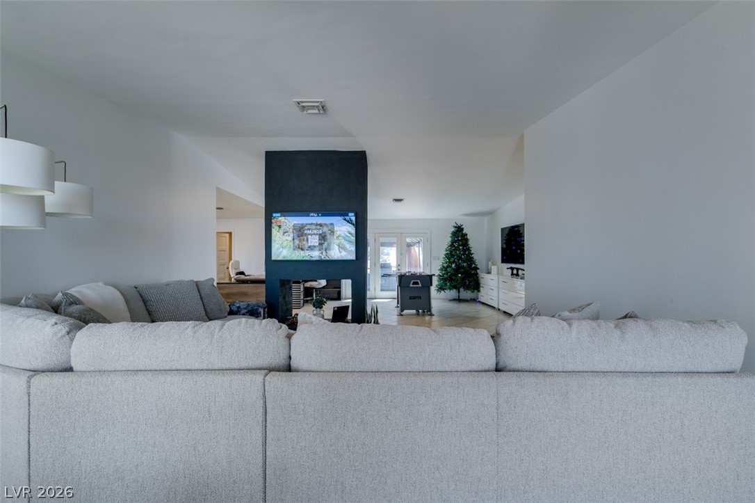 892 North Hollywood Boulevard Las Vegas, NV 89110 - Photo 81 of 81 This bright living space features an open floorplan with light hardwood flooring.