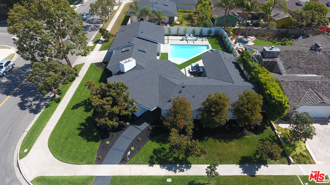 2048 Commodore Road Newport Beach, CA 92660 - Photo 2 of 39 an aerial view of a house with a garden and swimming pool