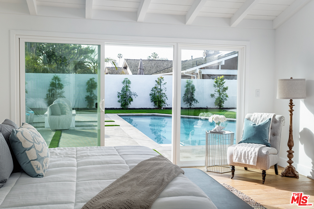 2048 Commodore Road Newport Beach, CA 92660 - Photo 22 of 39 a living room with furniture and a floor to ceiling window