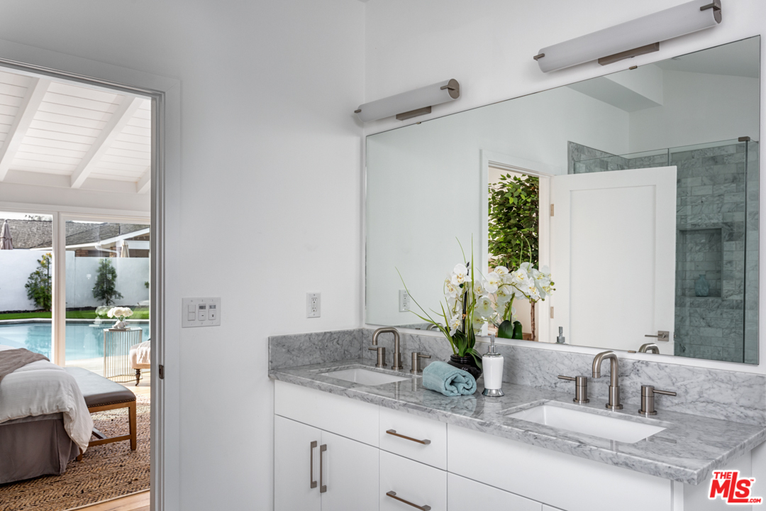2048 Commodore Road Newport Beach, CA 92660 - Photo 23 of 39 a bathroom with a granite countertop sink and a mirror