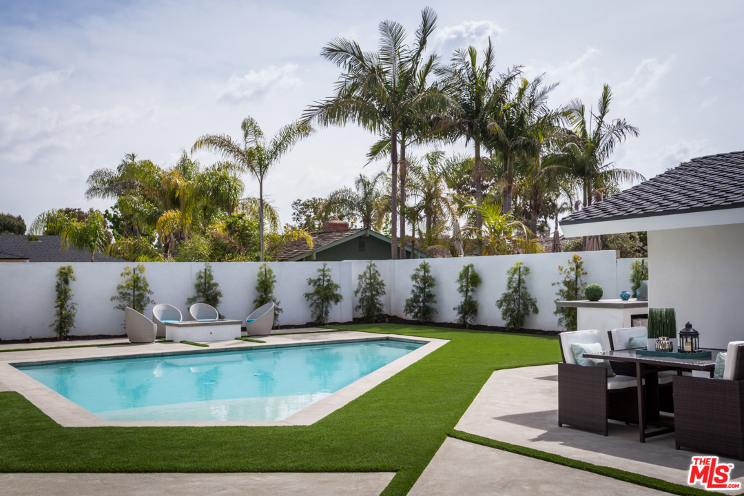 2048 Commodore Road Newport Beach, CA 92660 - Photo 29 of 39 a view of a swimming pool with a yard