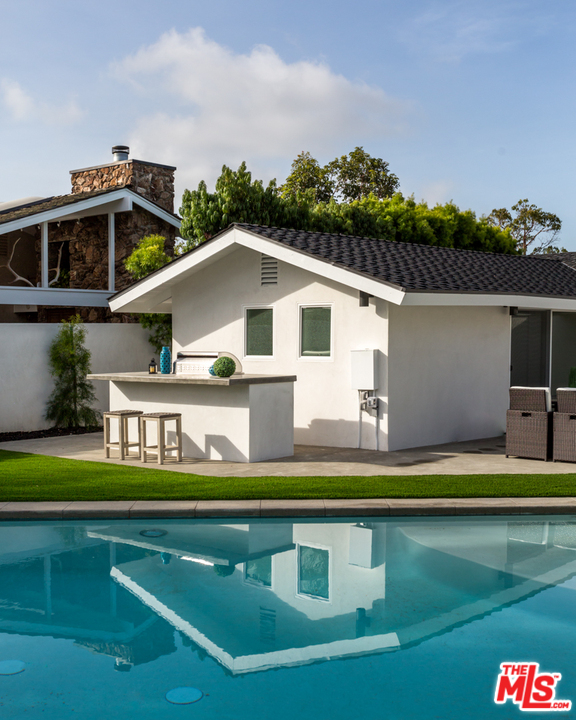 2048 Commodore Road Newport Beach, CA 92660 - Photo 34 of 39 a aerial view of a house with swimming pool and deck