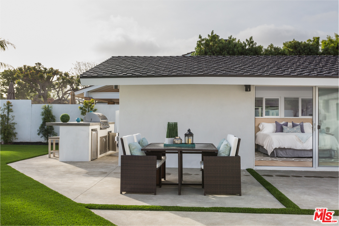 2048 Commodore Road Newport Beach, CA 92660 - Photo 36 of 39 a view of a patio with table and chairs