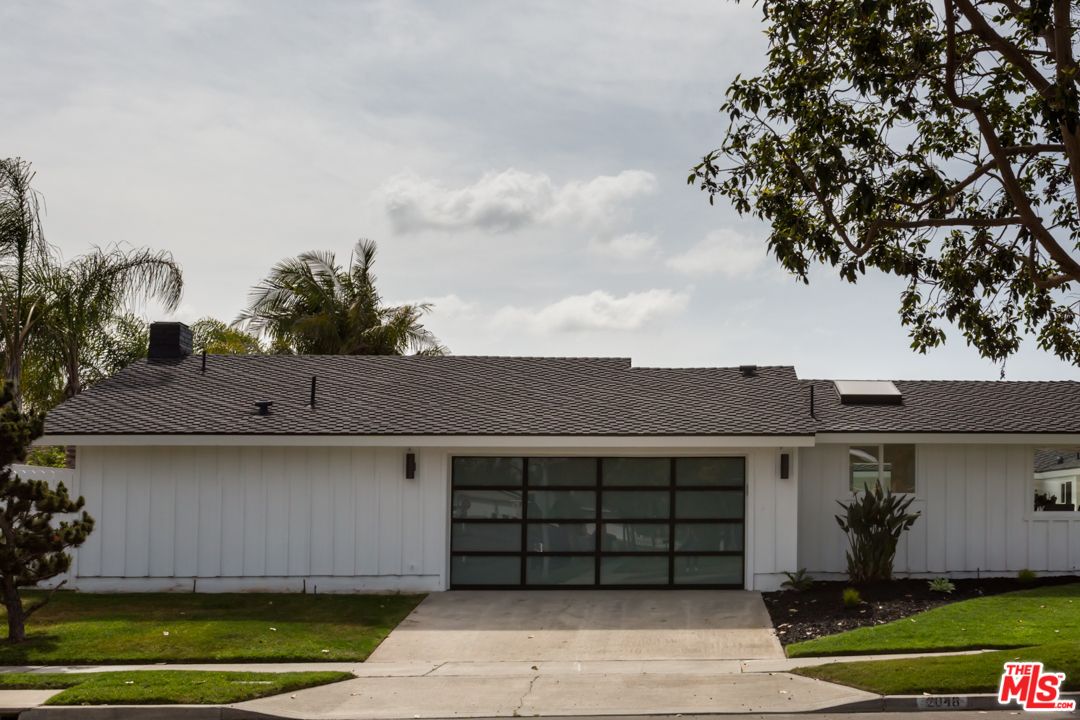 2048 Commodore Road Newport Beach, CA 92660 - Photo 38 of 39 a front view of a house with a garage