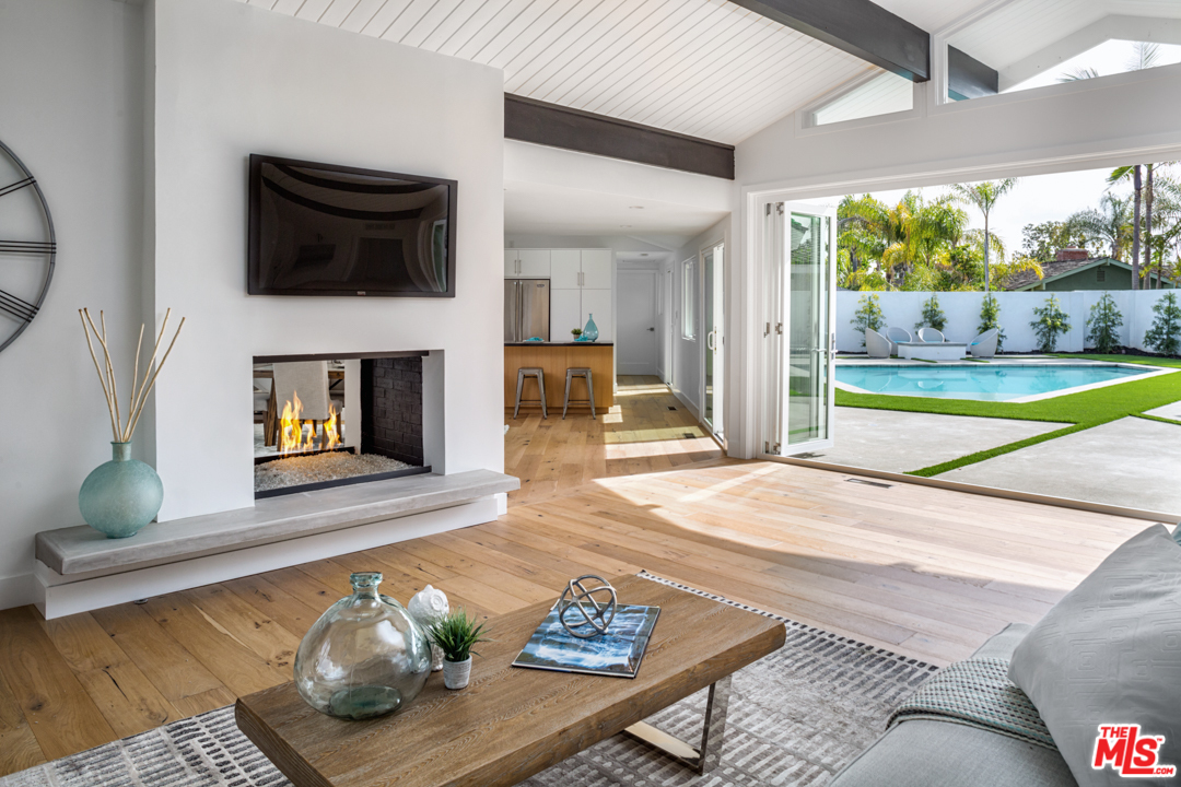 2048 Commodore Road Newport Beach, CA 92660 - Photo 5 of 39 a living room with furniture and a fireplace