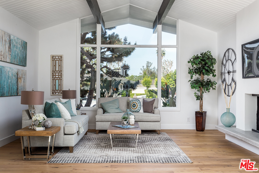 2048 Commodore Road Newport Beach, CA 92660 - Photo 8 of 39 a living room with furniture and a large window