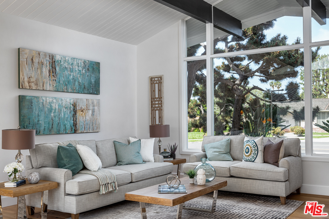 2048 Commodore Road Newport Beach, CA 92660 - Photo 9 of 39 a living room with furniture and a large window