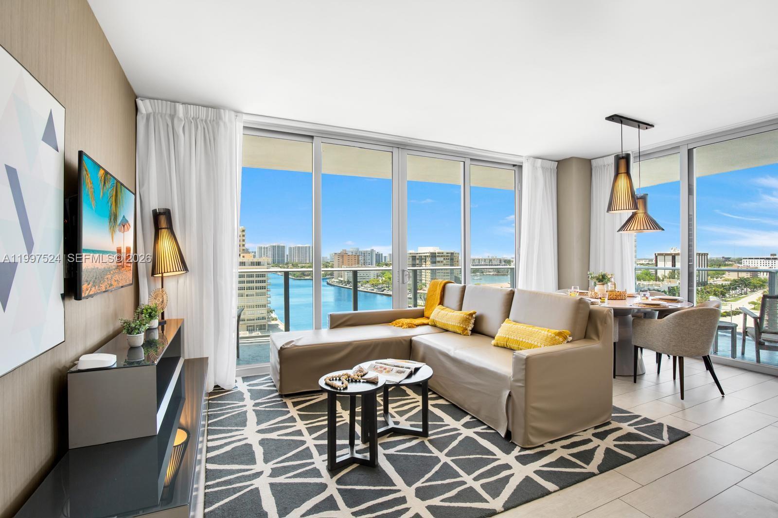 4010 South Ocean Drive, Unit R708 Hollywood, FL 33019 - Photo 11 of 35 a living room with furniture fireplace and a large window