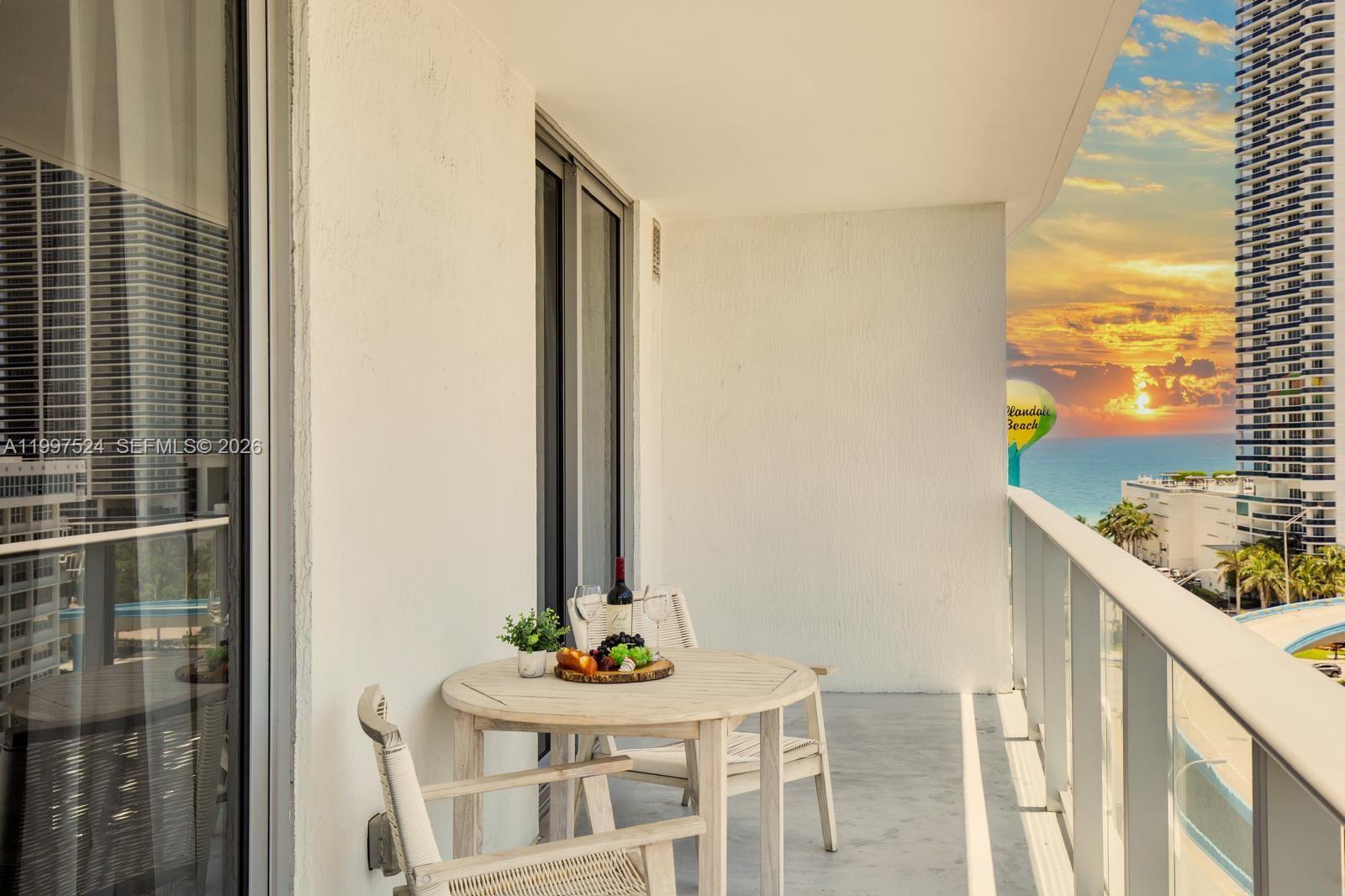 4010 South Ocean Drive, Unit R708 Hollywood, FL 33019 - Photo 12 of 35 a view of a balcony with table and chairs