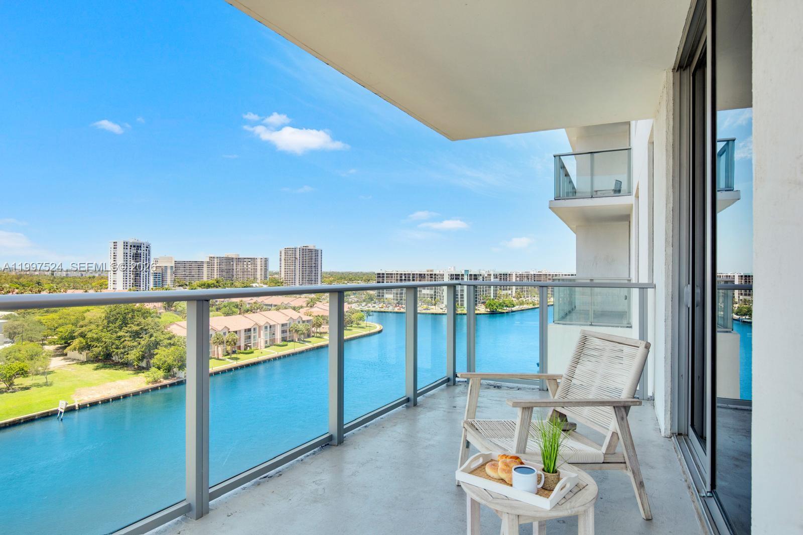 4010 South Ocean Drive, Unit R708 Hollywood, FL 33019 - Photo 13 of 35 a view of a chairs and table in a balcony