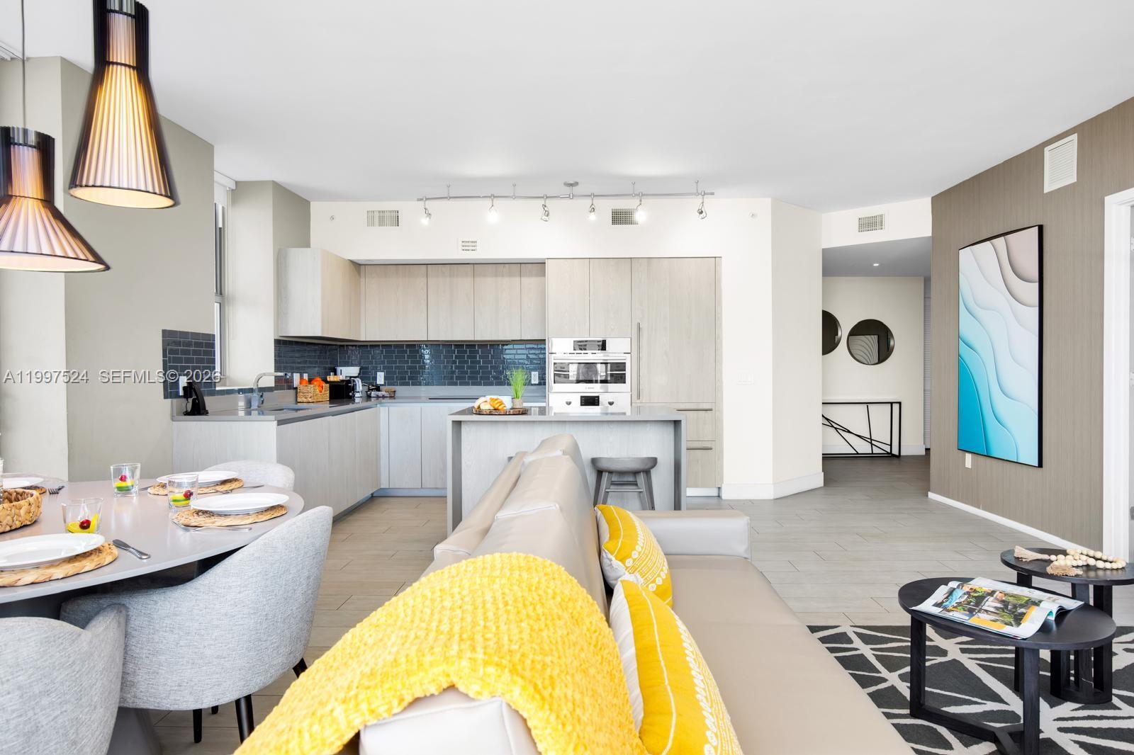 4010 South Ocean Drive, Unit R708 Hollywood, FL 33019 - Photo 23 of 35 a living room with stainless steel appliances kitchen island granite countertop furniture and a kitchen view