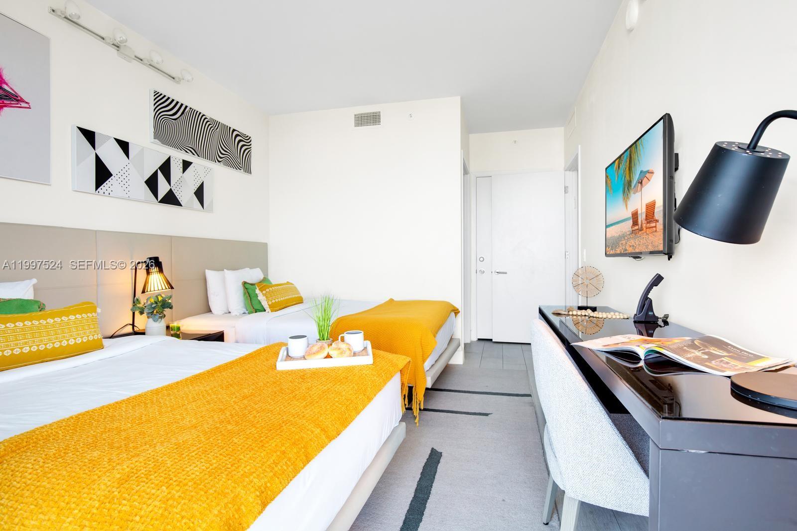 4010 South Ocean Drive, Unit R708 Hollywood, FL 33019 - Photo 25 of 35 a bedroom with a bed and furniture
