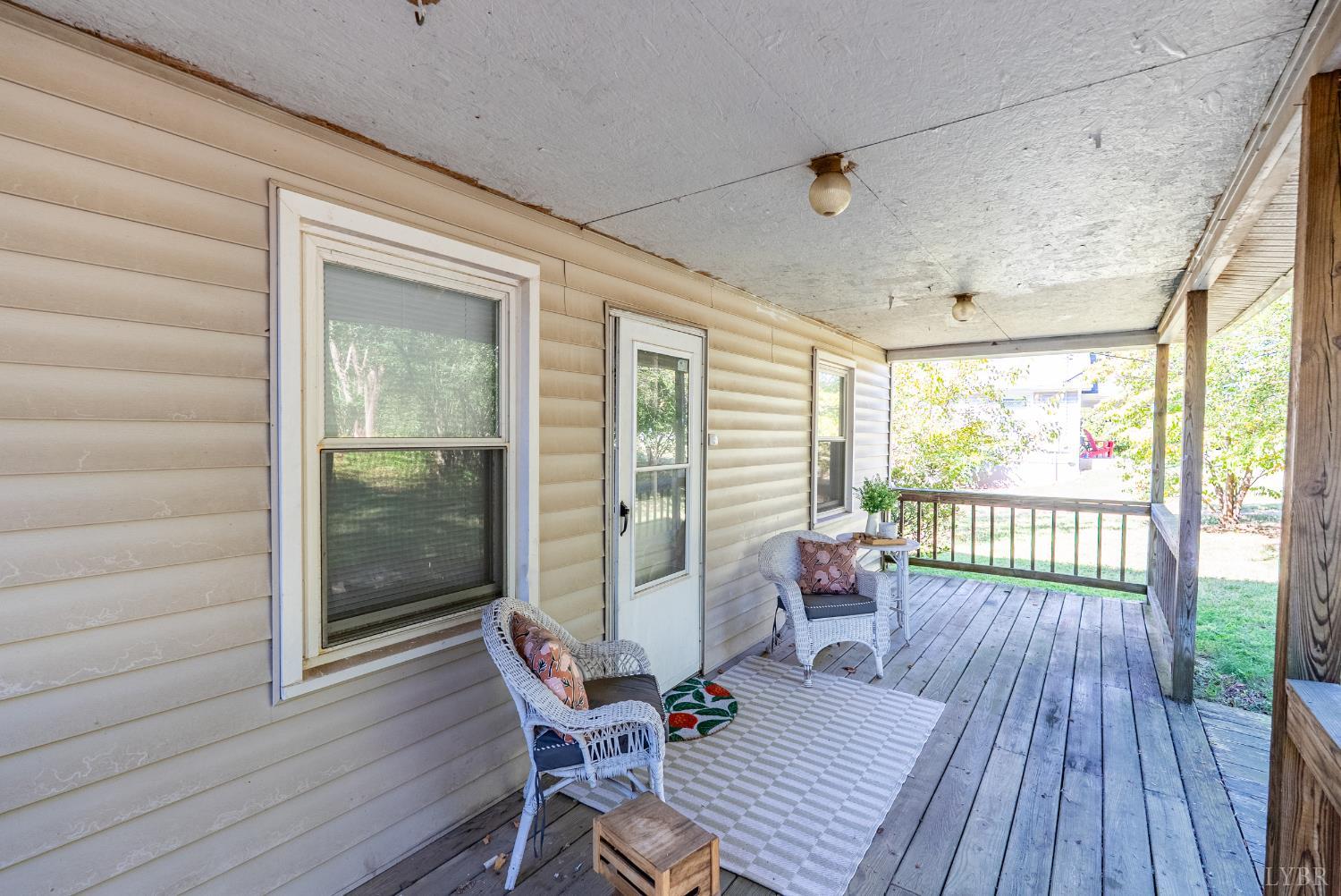 3660 Depot Road Rustburg, VA 24588 - Photo 22 of 36 a view of a porch with wooden floor