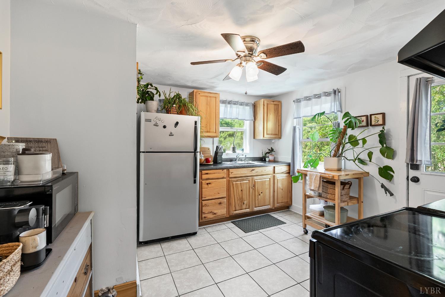3660 Depot Road Rustburg, VA 24588 - Photo 5 of 36 a kitchen with a refrigerator and a stove