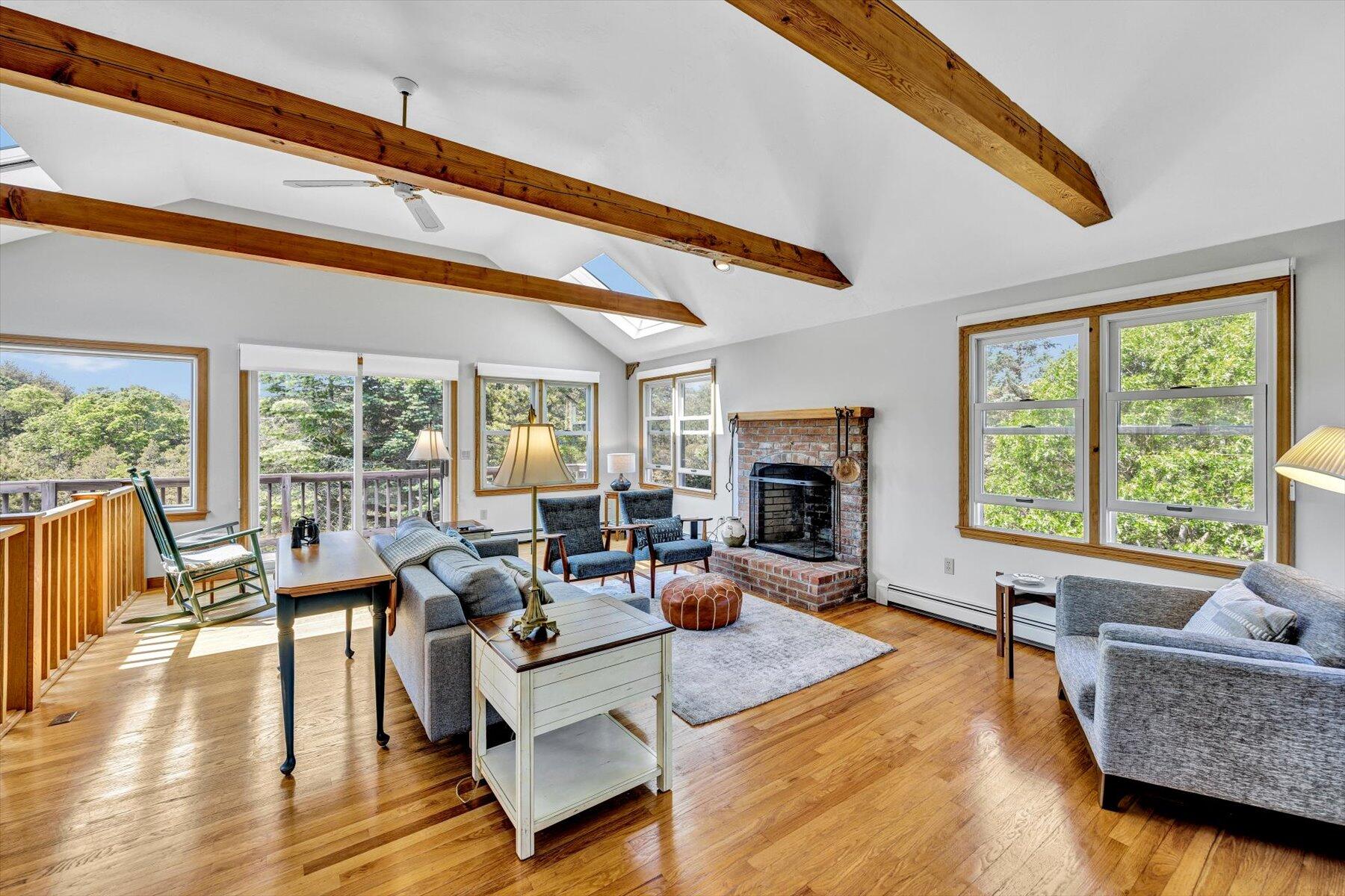 3 Amber Way Truro, MA 02666 - Photo 15 of 43 a living room with fireplace furniture and a large window