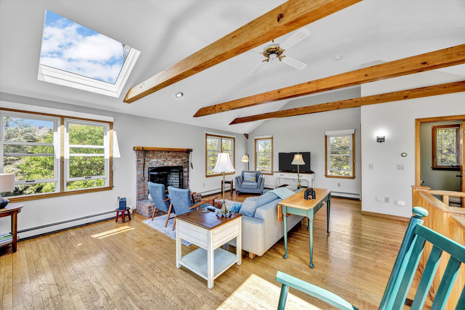3 Amber Way Truro, MA 02666 - Photo 17 of 43 a living room with fireplace furniture and a large window