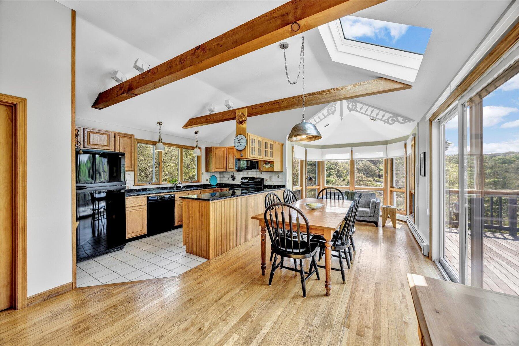 3 Amber Way Truro, MA 02666 - Photo 20 of 43 a dining room with furniture and wooden floor