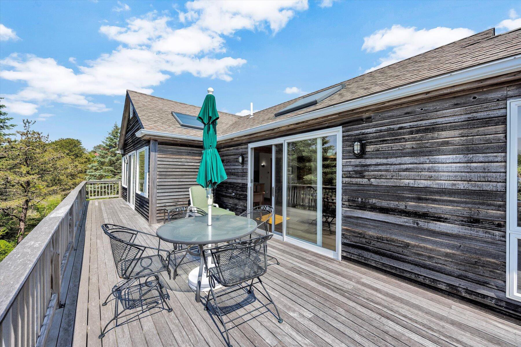 3 Amber Way Truro, MA 02666 - Photo 26 of 43 a balcony with table and chairs