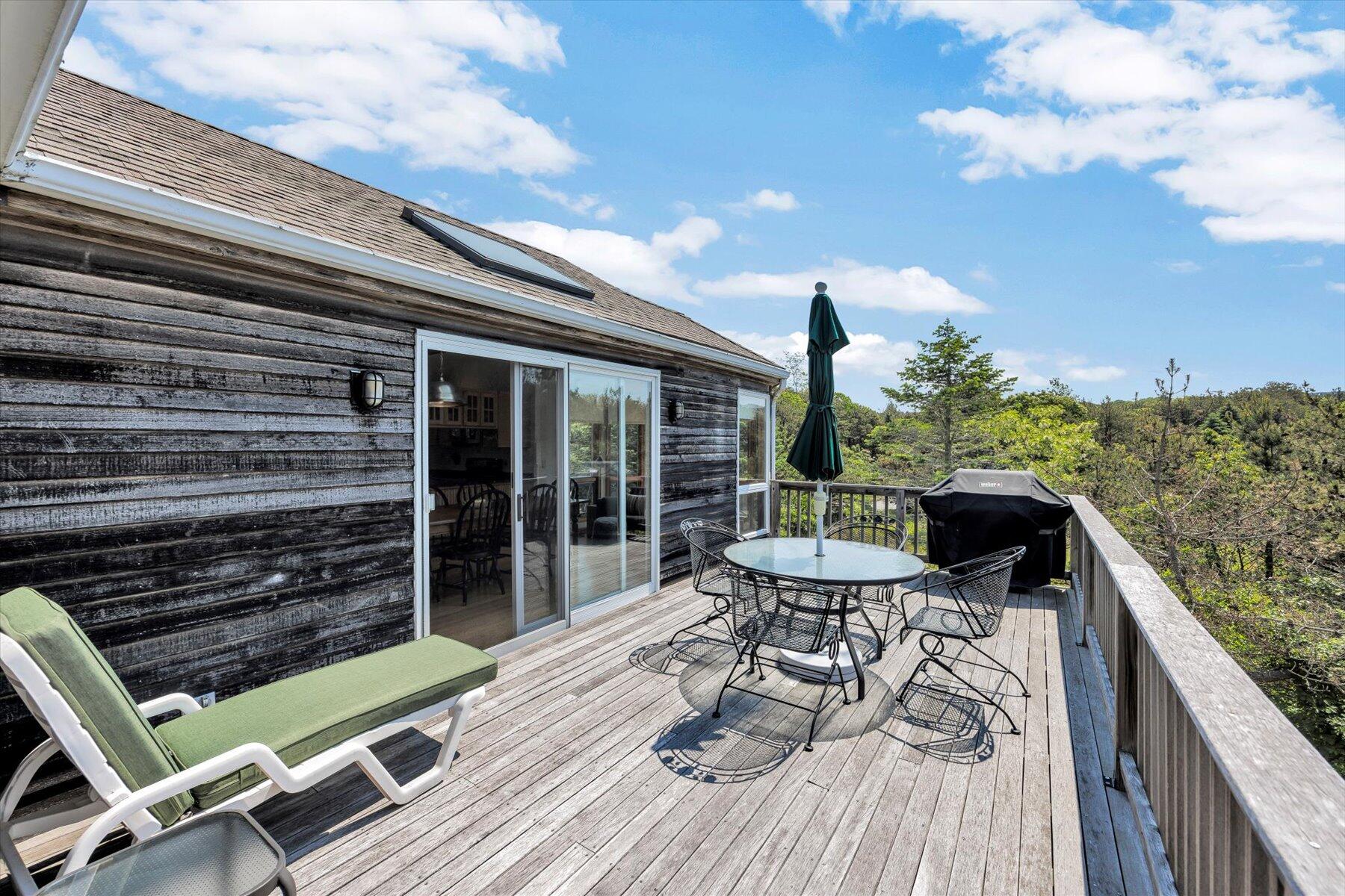 3 Amber Way Truro, MA 02666 - Photo 28 of 43 a view of a balcony with chairs and wooden floor