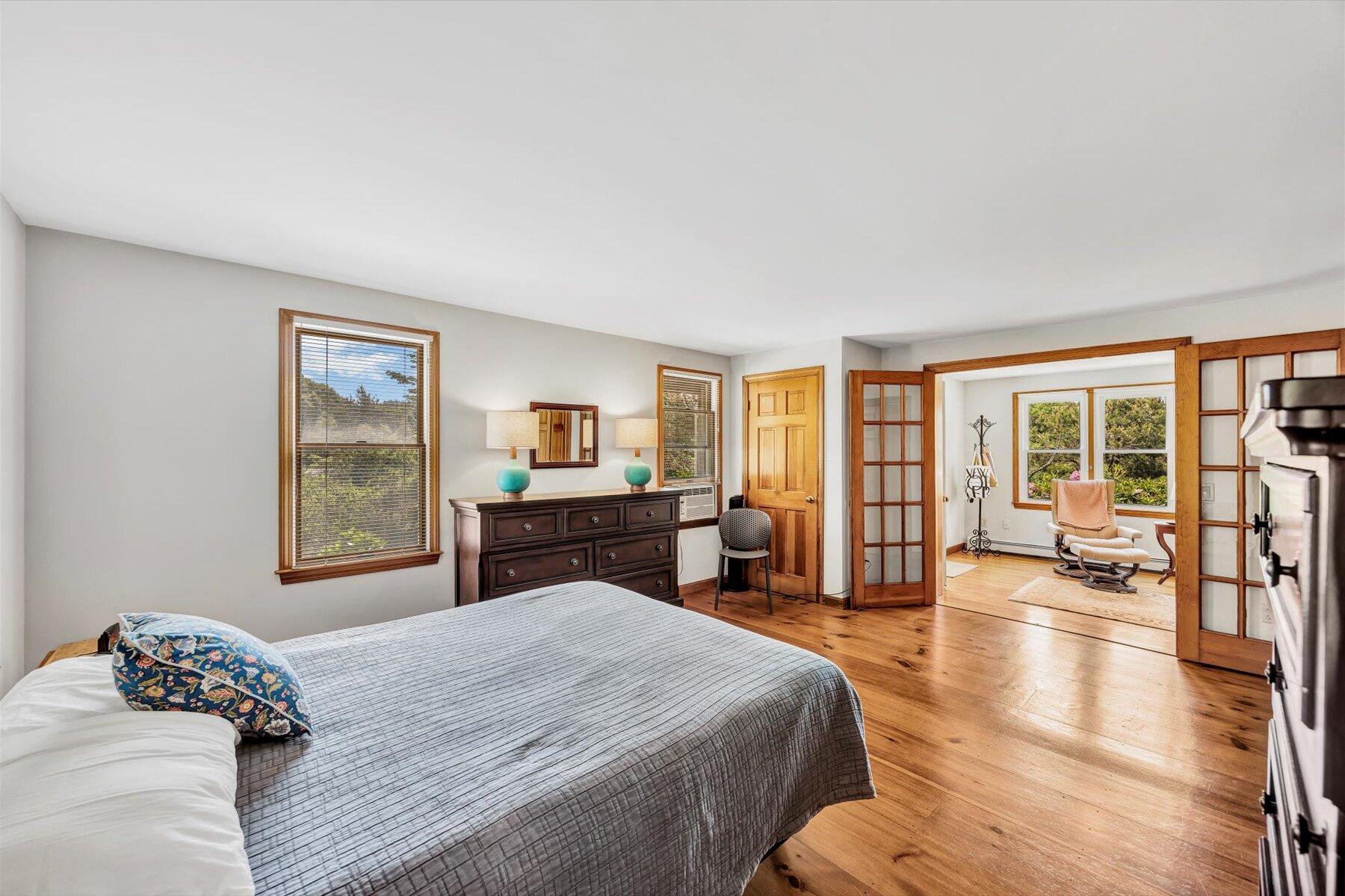 3 Amber Way Truro, MA 02666 - Photo 29 of 43 a bedroom with a large bed a large window and walk in closet