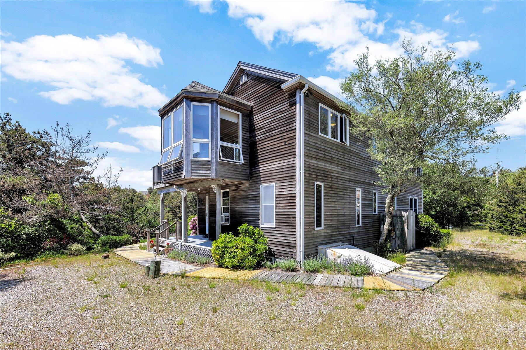 3 Amber Way Truro, MA 02666 - Photo 3 of 43 a view of a house with a yard