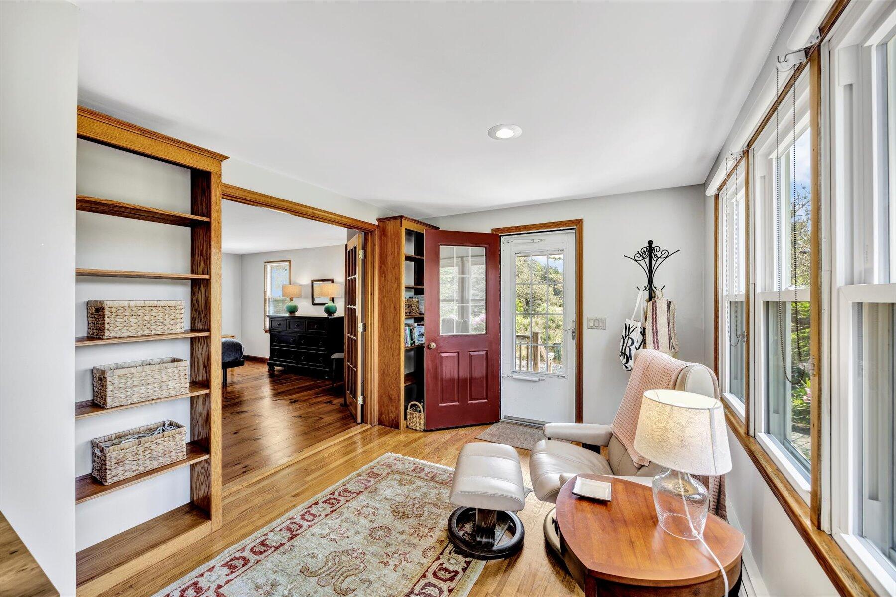 3 Amber Way Truro, MA 02666 - Photo 32 of 43 a living room with furniture and a floor to ceiling window