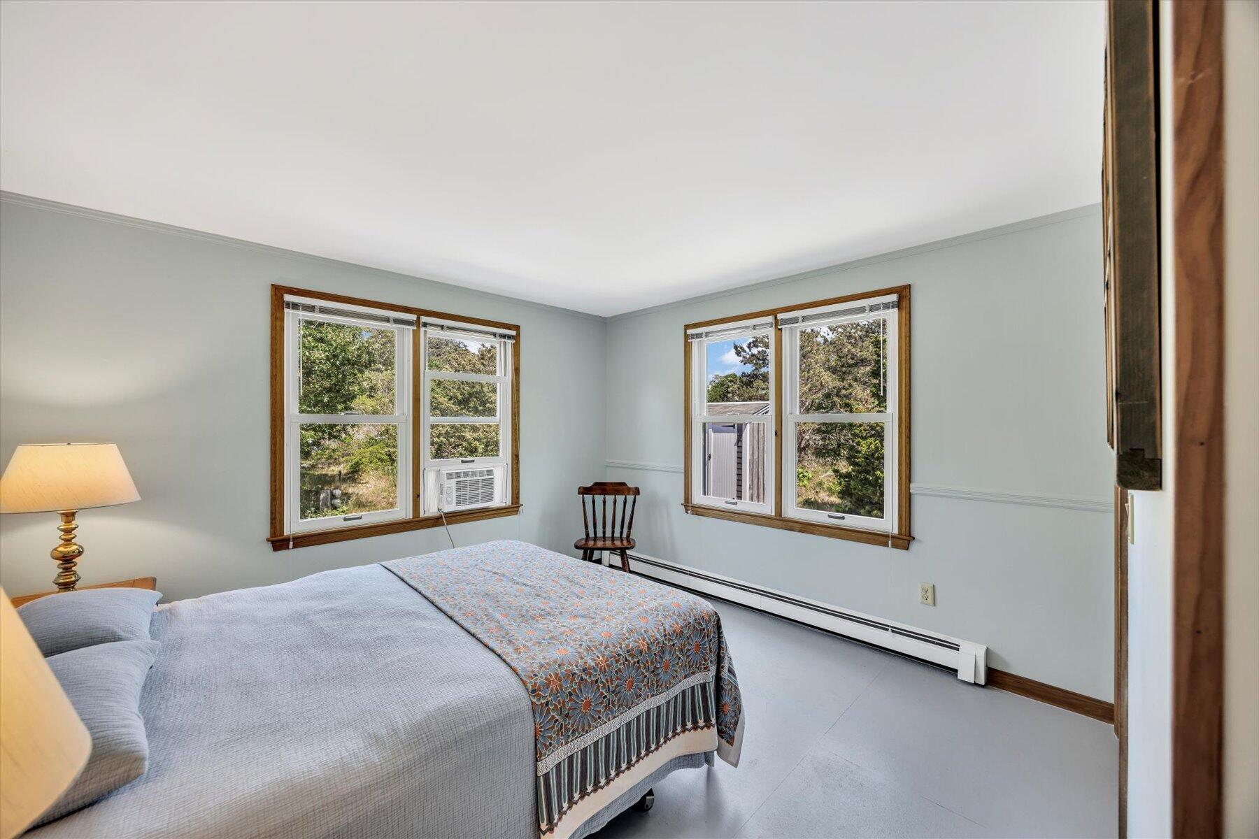 3 Amber Way Truro, MA 02666 - Photo 34 of 43 a bedroom with a bed lamp and a window