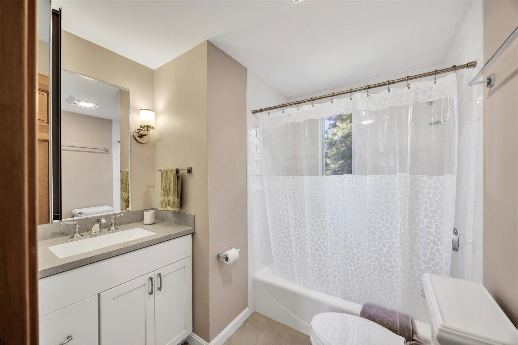 3 Amber Way Truro, MA 02666 - Photo 39 of 43 a bathroom with a granite countertop sink and a mirror