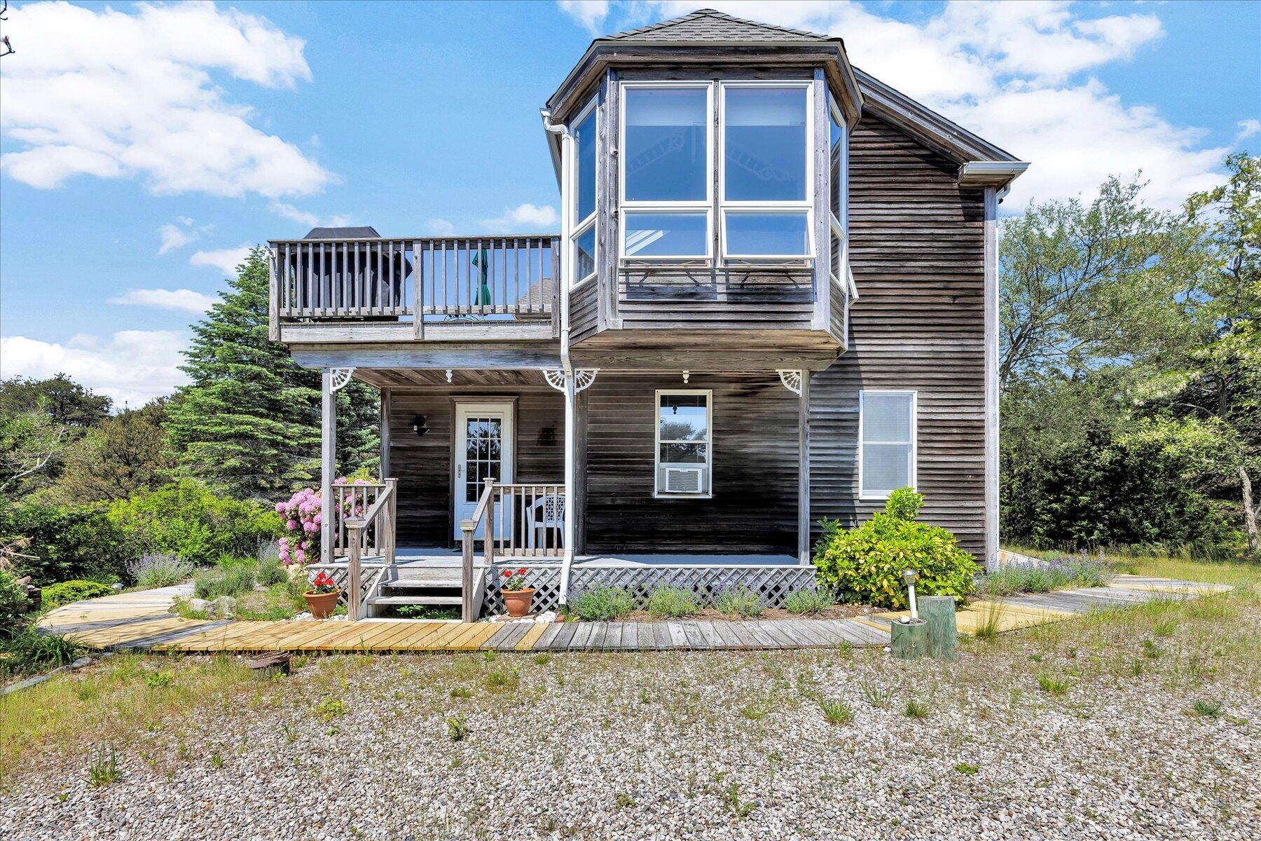3 Amber Way Truro, MA 02666 - Photo 4 of 43 front view of a house with a yard