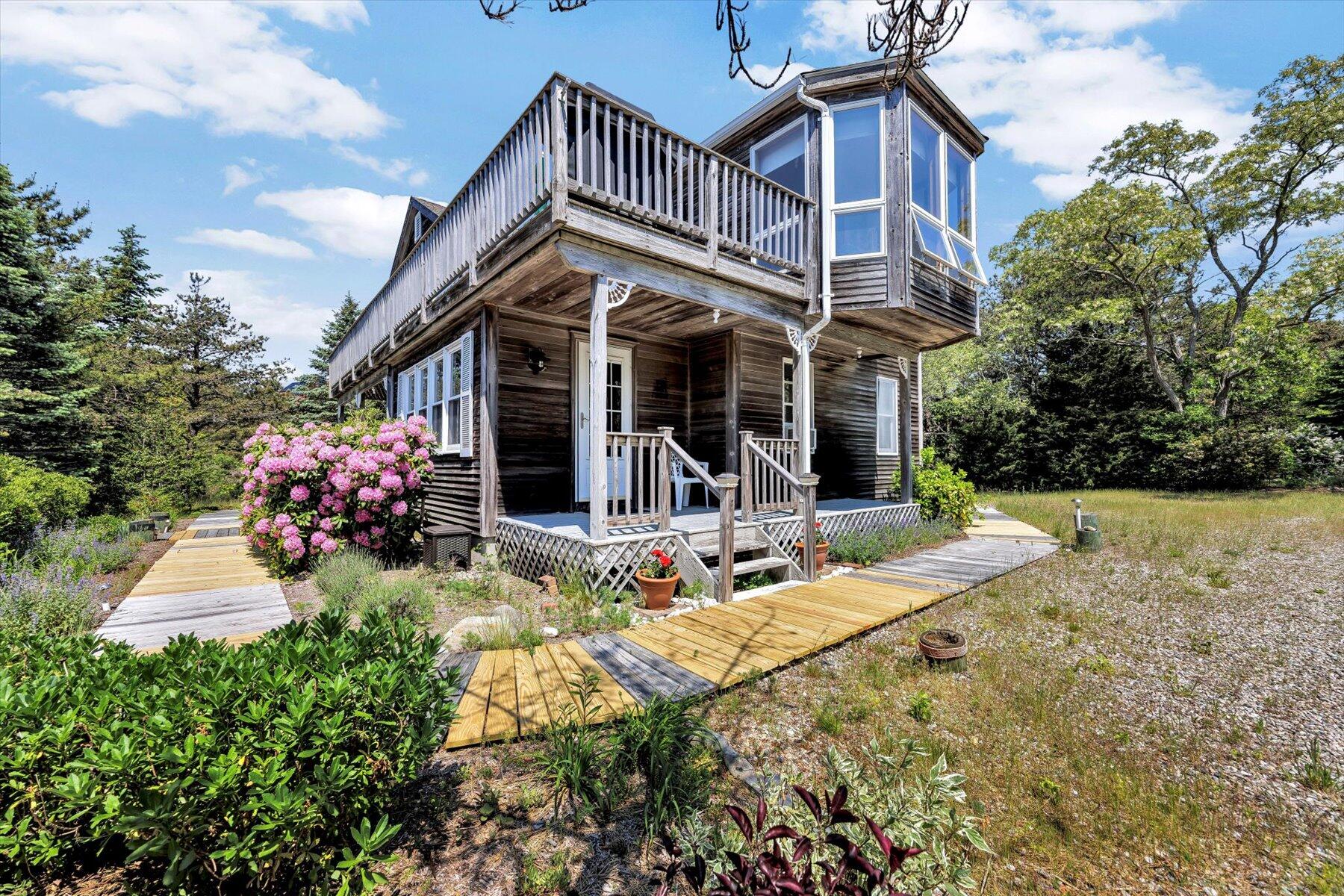 3 Amber Way Truro, MA 02666 - Photo 5 of 43 a view of a house with yard and garden