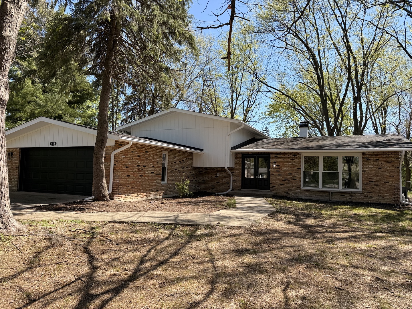 28W555 Leverenz Road Naperville, IL 60564 - Photo 2 of 24 a house with trees in front of it