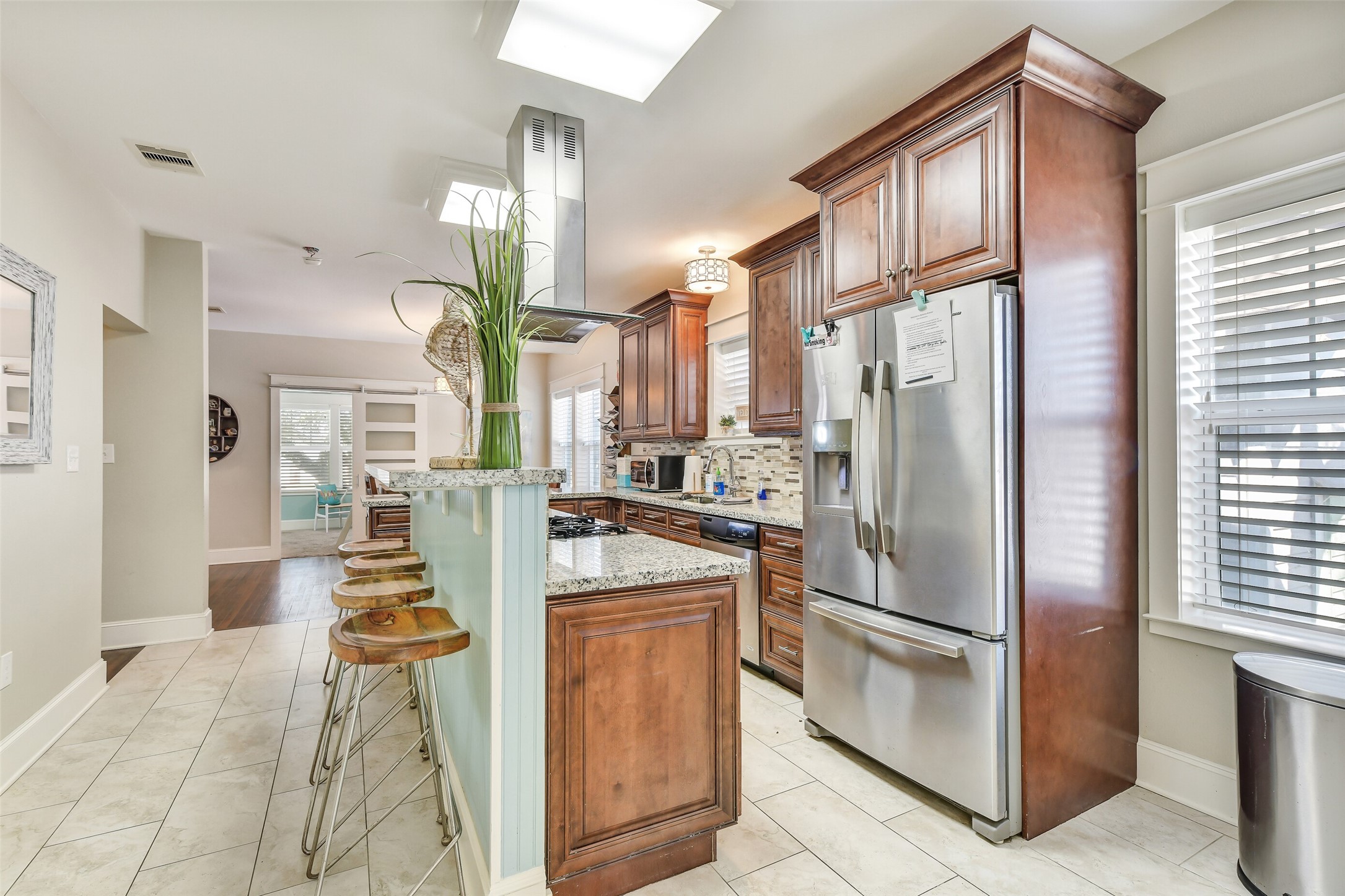 3807 Avenue R Galveston, TX 77550 - Photo 13 of 46 The island with breakfast bar currently seats 4.