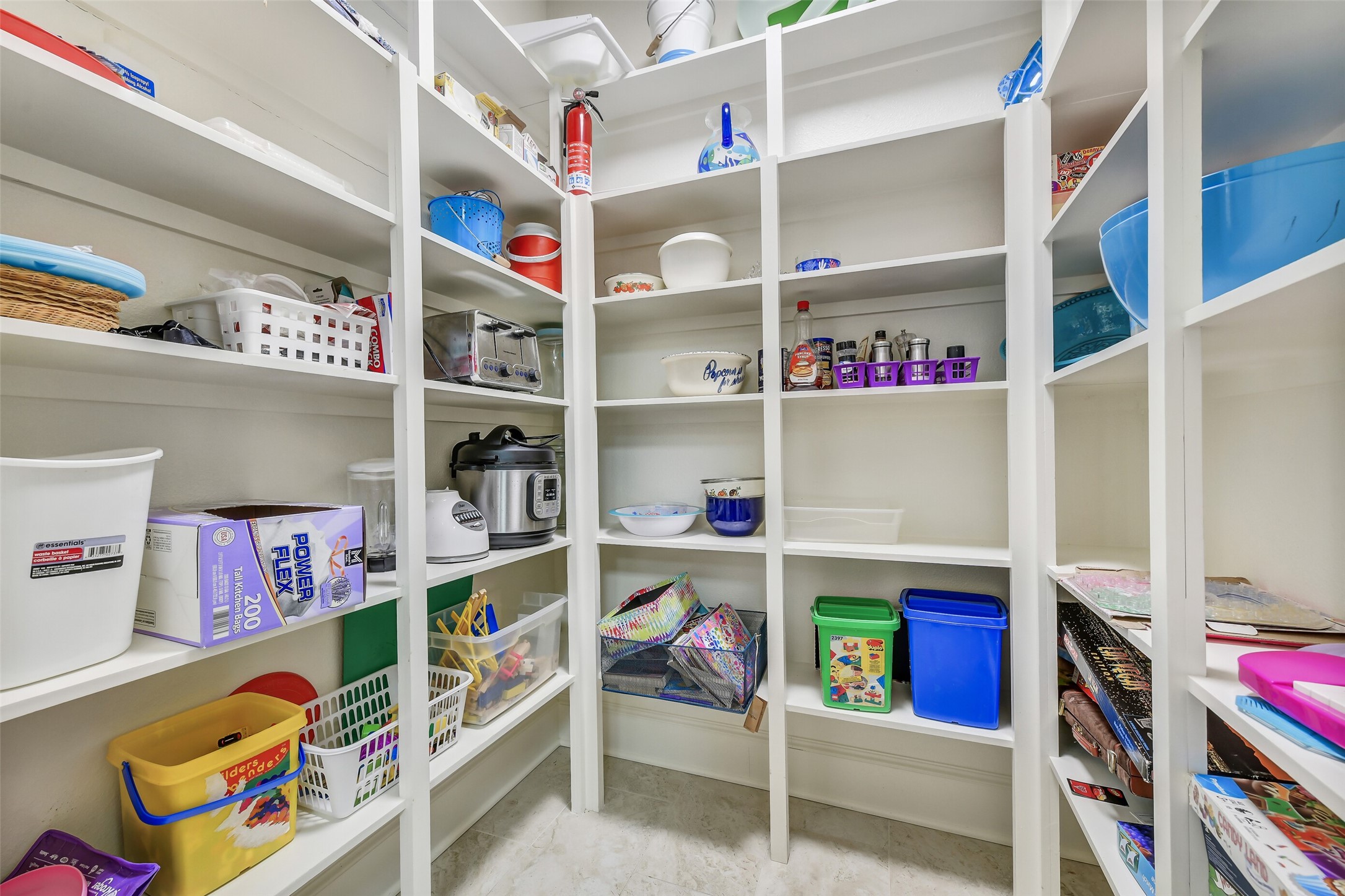 3807 Avenue R Galveston, TX 77550 - Photo 15 of 46 The large walk-in pantry provides generous storage space, offering ample shelving and organization for all your kitchen essentials.
