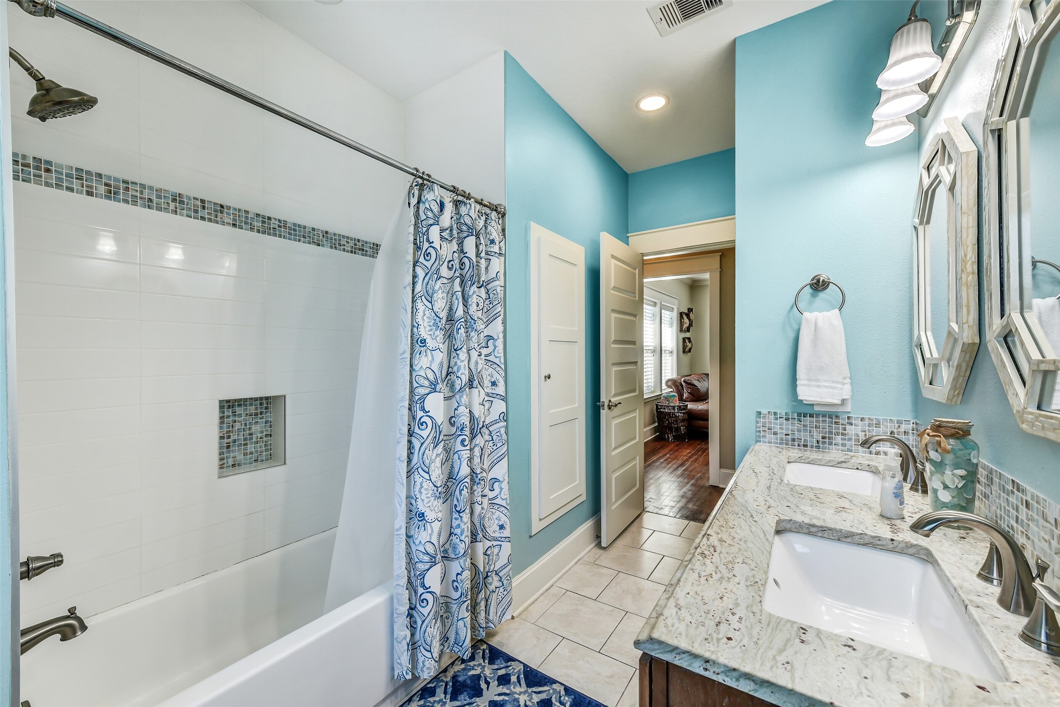 3807 Avenue R Galveston, TX 77550 - Photo 24 of 46 This bathroom offers a tub/shower combo and an additional linen closet.