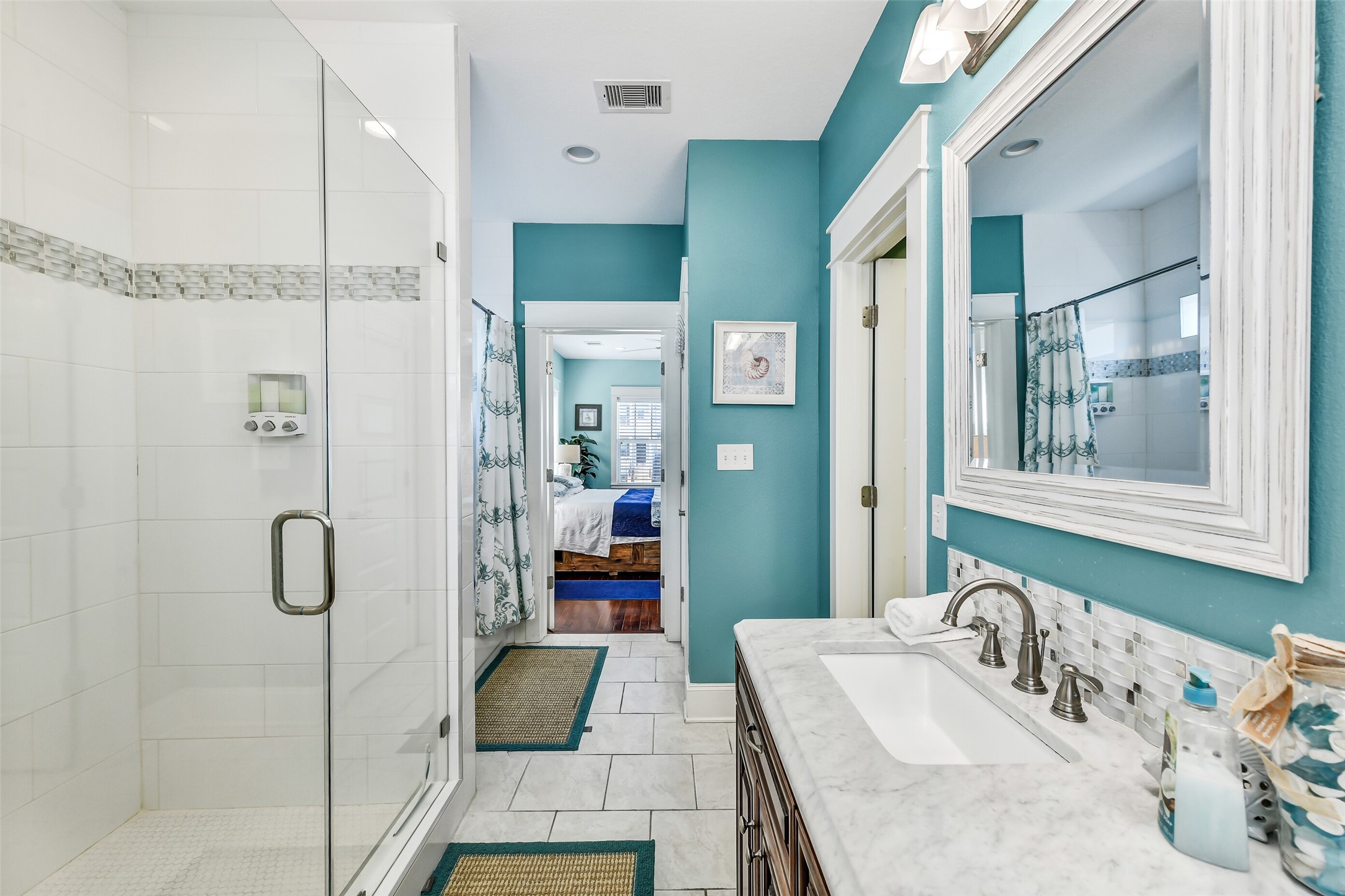 3807 Avenue R Galveston, TX 77550 - Photo 30 of 46 This bathroom offers an impressive amount of space and functionality.