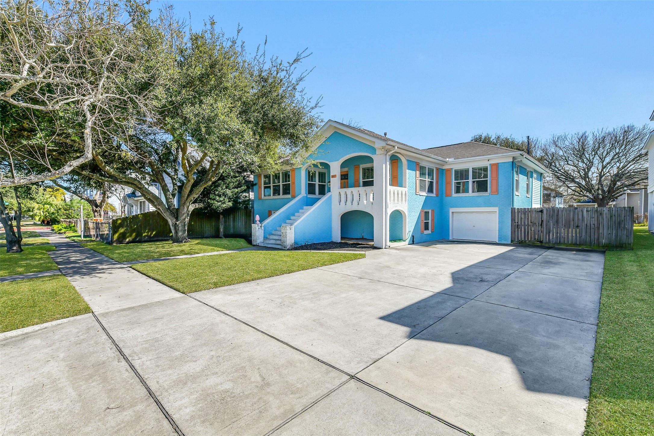 3807 Avenue R Galveston, TX 77550 - Photo 3 of 46 The home provides generous parking with a double-wide driveway, garage, and additional street parking.