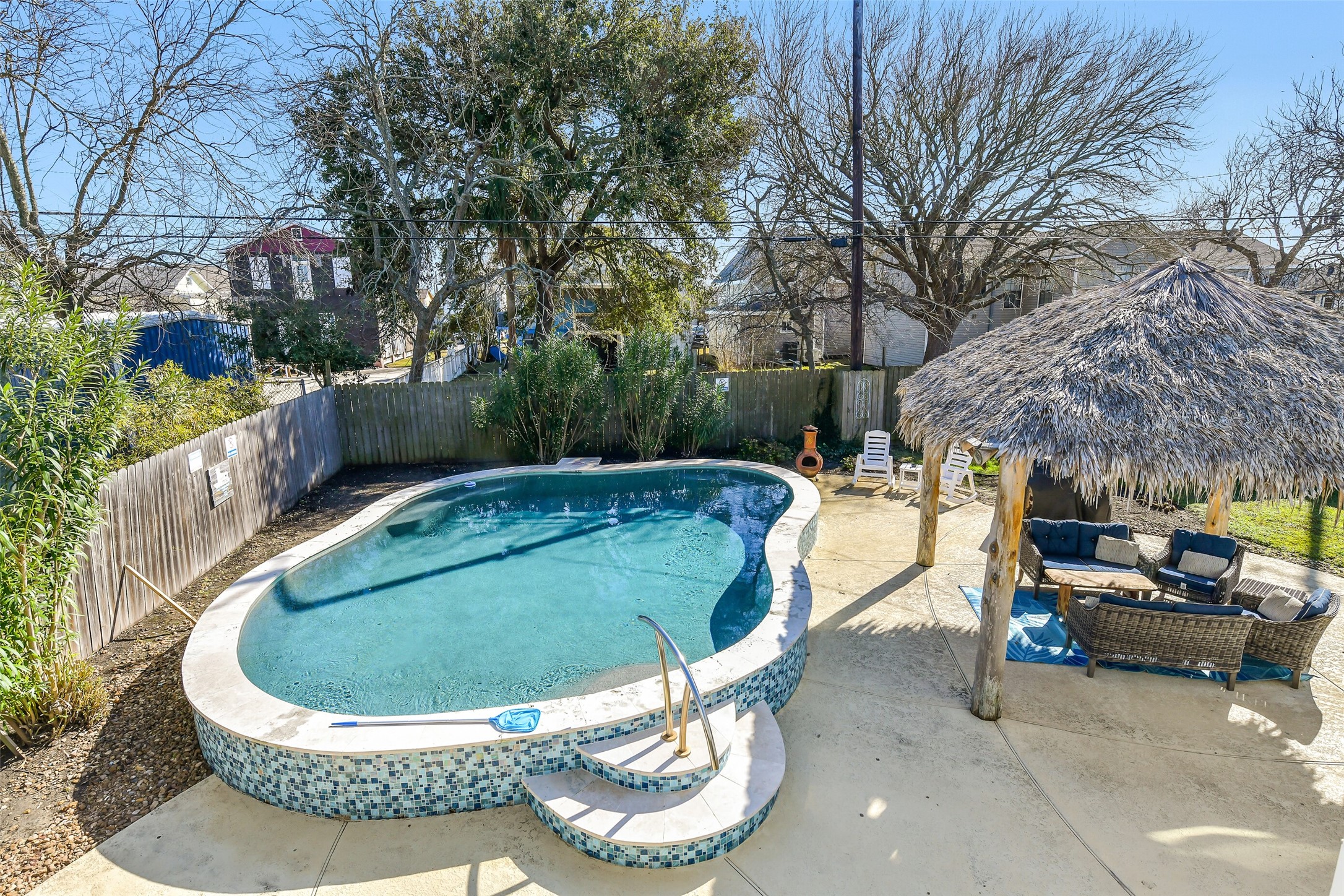 3807 Avenue R Galveston, TX 77550 - Photo 34 of 46 Designed for entertaining, the backyard oasis features multiple seating areas, a palapa, and a pool for the ultimate outdoor retreat.