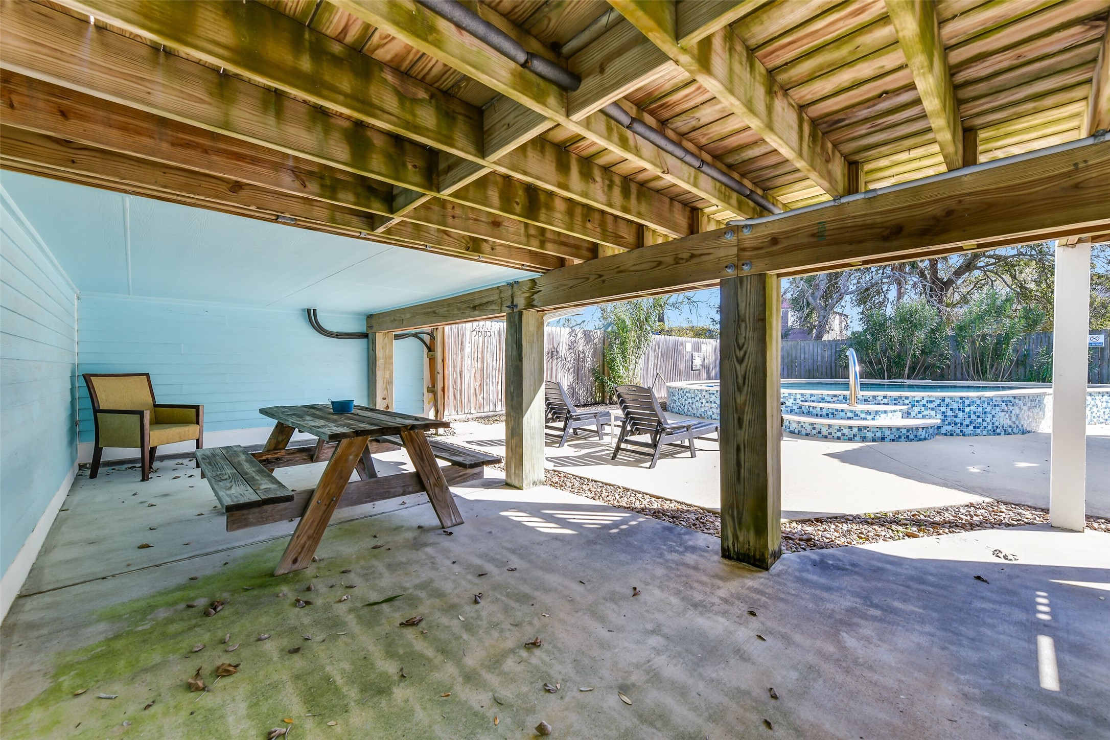 3807 Avenue R Galveston, TX 77550 - Photo 37 of 46 Underneath the back porch you will find this shaded seating area.