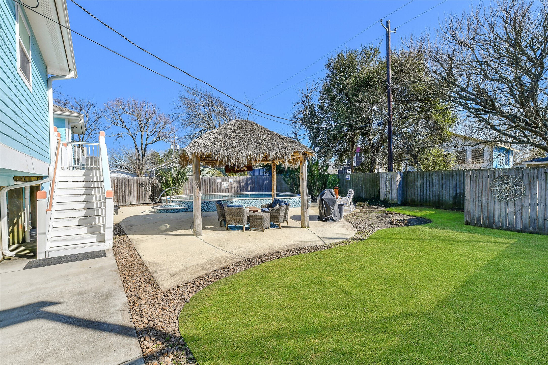 3807 Avenue R Galveston, TX 77550 - Photo 40 of 46 The fully fenced backyard also features a generously sized yard.