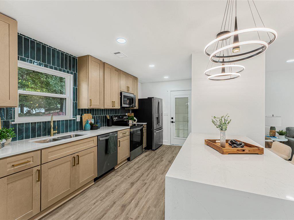 531 Carlton Road Palmetto, GA 30268 - Photo 12 of 38 a kitchen with a sink stove and microwave