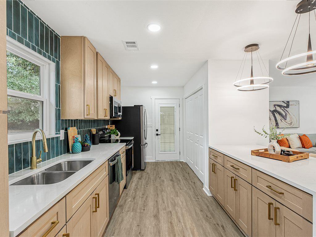 531 Carlton Road Palmetto, GA 30268 - Photo 13 of 38 a kitchen with a sink stove top oven and refrigerator