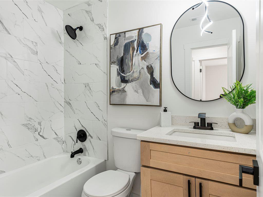 531 Carlton Road Palmetto, GA 30268 - Photo 18 of 38 a bathroom with a sink mirror and toilet