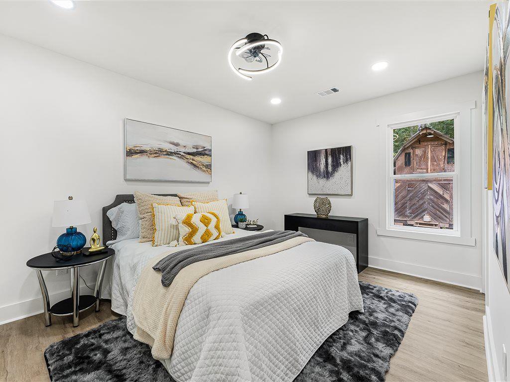 531 Carlton Road Palmetto, GA 30268 - Photo 23 of 38 a bedroom with bed and a painting on the wall